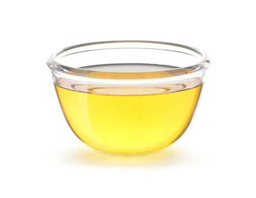 Small, clear glass bowl of vegetable oil